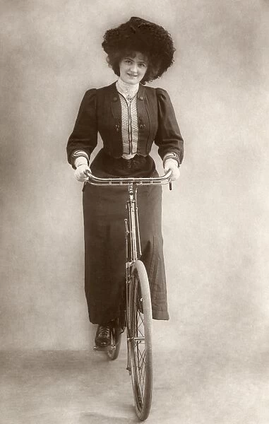 ENGLISHWOMAN ON BICYCLE. Photograph, c1915