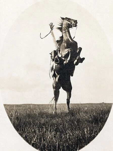 ERWIN E. SMITH (1886-1947). American cowboy photographer. Photographed riding a bucking bronco on the open range of Texas on 14 December 1908