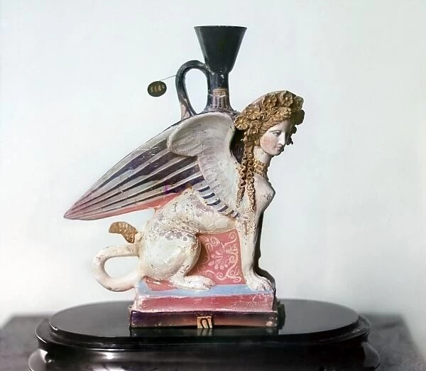 ETRUSCAN VASE. Painted Etruscan vase in the shape of a female sphinx, 8th - 5th century B