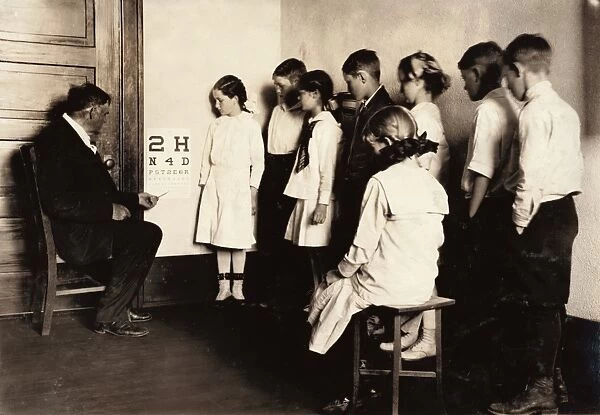 EYE EXAM, 1917. School children receiving eye exams at Washington School in Lawton, Oklahoma
