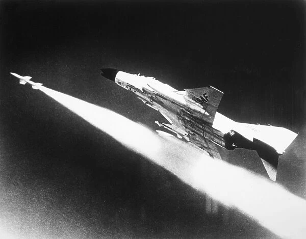 F-4 Phantom II fighter aircraft firing a missile, 1966