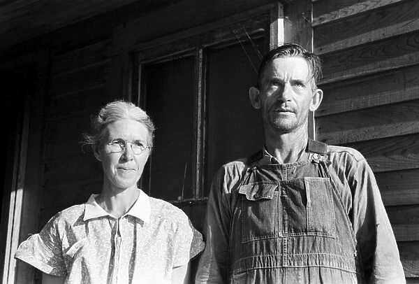 FARM COUPLE, 1938. Sharecropper and wife near Carutherville, Missouri. Photograph by Russell Lee