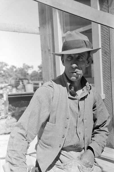 FARMER, 1940. A farmer in Pie Town, New Mexico. Photograph by Russell Lee, 1940