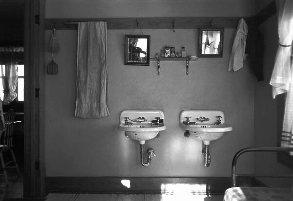 FARMHOUSE WASHROOM, 1936. Washroom in a farmhouse near Dickens, Iowa. Photograph by Russell Lee, December 1936