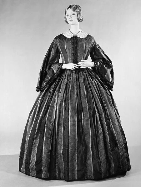 FASHION: DRESS, c1860. Blue silk dress with woven yellow, black and white stripes, American, c1860