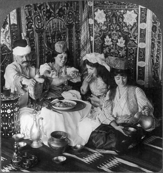 Feasting in the harem, Constantinople, Turkey. Stereograph, c1913