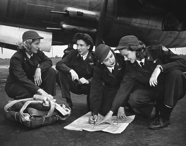 Four female pilots looking at a chart. Photograph, c1941