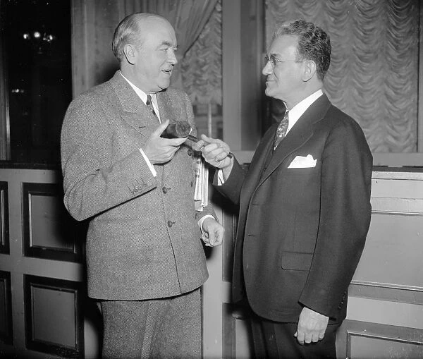 FERDINAND PECORA (1882-1971). American jurist. Pecora, right, photographed with former Minnesota Supreme Court Justice John P. Devaney, whom Pecora succeeded as the President of the National Lawyers Guild. Devaney relinquishing the gavel during the annual convention in Washington, D. C. 22 February 1938