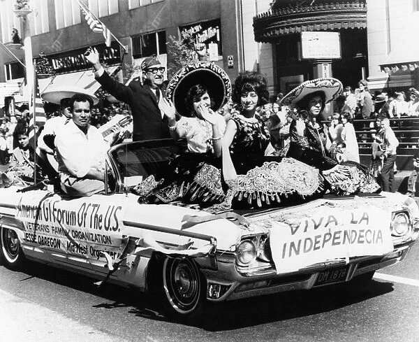 A festive automobile float proceeding along State Street in Chicago, Illinois, during the Mexican Independence Day parade, 14 September 1963, commemorating the start of Mexicos War of Independence against Spain in 1810