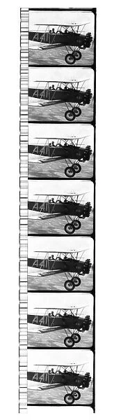 FILM: BIPLANE. Strip of film showing a biplane in flight and the sound track, 1920s