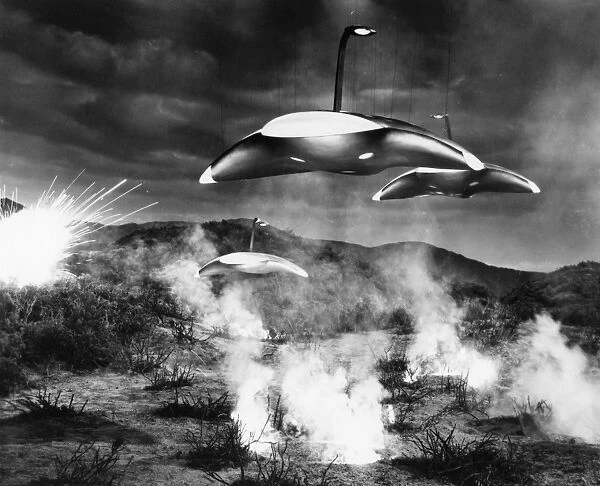 FILM STILL: UFOS. Film still showing flying saucers and explosions, c1950