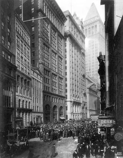 FINANCIAL CENTER, c1920. Crowd of men involved in curb exchange trading on Broad Street, New York City. Photograph, c1920