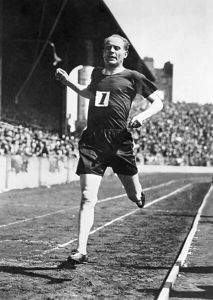 Finnish long-distance runner. Winning the 4 mile event at the British games at Stamford Bridge, 1931