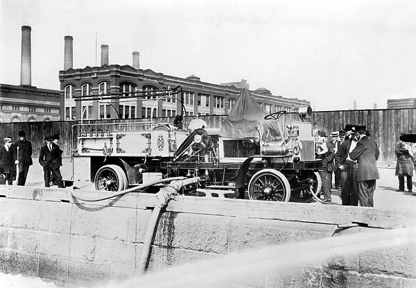 FIRE ENGINE, c1911. Fire engine of the Fire Department of New York being filled with water