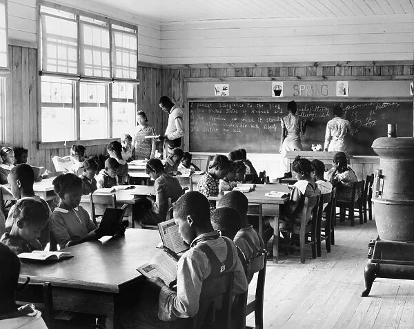 A first grade classroom in Gees Bend, Alabama, showing the extreme ages of the students. Photograph by Marion Post Wolcott, 1939