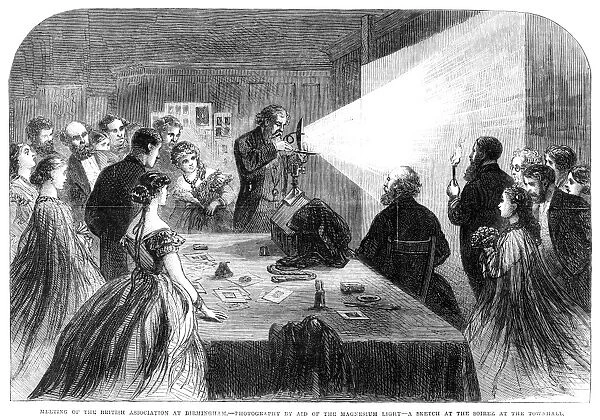 FLASH PHOTOGRAPHY, 1865. Demonstration of flash photography with a magnesium light