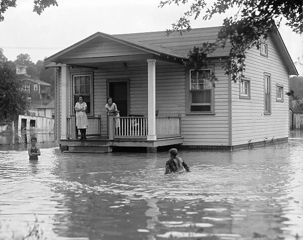 FLOOD, 1922. Children on the porch of a flooded house. Photograph, 2 September 1922