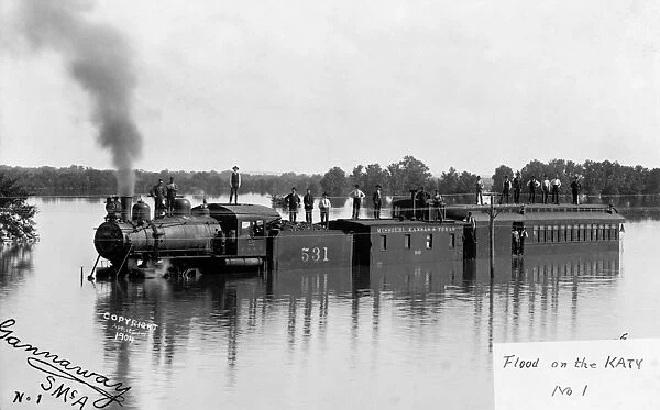 FLOOD, c1904. A train of the Missouri-Kansas-Texas Railroad under flood waters