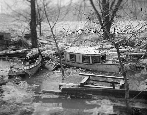 FLOOD, c1915. Boats and debris stuck in the ice of the Potomac River after a flood