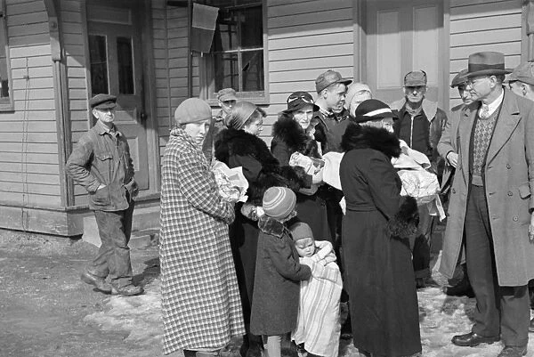 FLOOD REFUGEES, 1937. A group of refugees on the streets of McLeansboro, Illinois