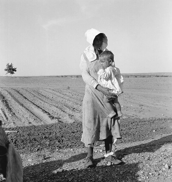 FLOOD REFUGEES, 1937. A mother and child of flood refugee family near Memphis, Texas