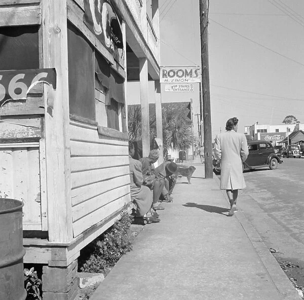 FLORIDA, 1943. Street scene in Daytona Beach, Florida. Photograph by Gordon Parks