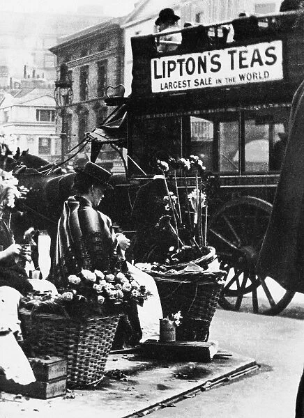 Flower seller in Piccadilly Circus, London, England. Photographed c1900