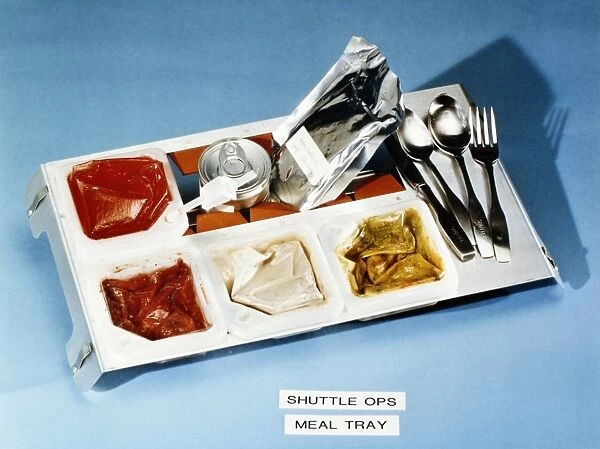 Food tray containing smoked turkey, mixed vegetables, strawberries and cream of mushroom soup, prepared for astronauts aboard the Space Shuttle Columbia for mission STS-5, 1982