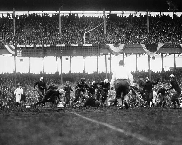 FOOTBALL GAME, 1925. An unidentified player for the Chicago Bears attempting to gain yards in a game against the New York Giants, at the Polo Grounds in New York City, 6 December 1925