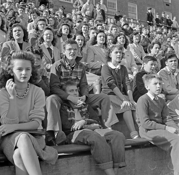 FOOTBALL GAME, 1943. Spectators at a football game at Woodrow Wilson High School in Washington D