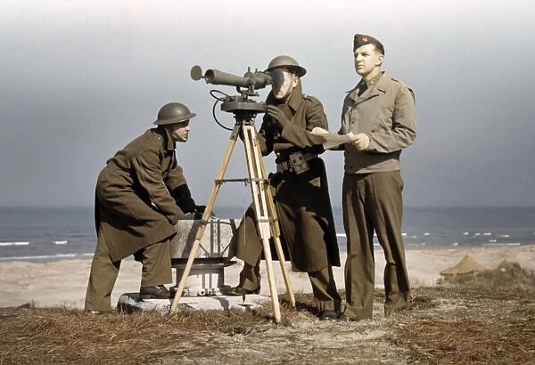 FORT STORY, 1942. American servicemen operating an azimuth instrument at Fort Story in Virginia