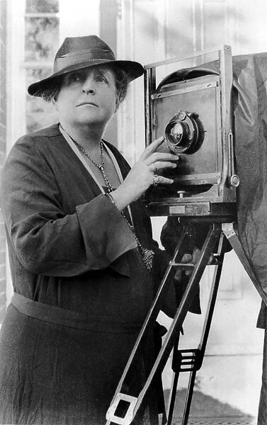FRANCES BENJAMIN JOHNSTON (1864-1952). American photographer, adjusting the lens
