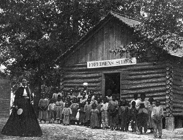 FREEDMEN SCHOOL, c1867. A teacher and her pupils in front of a Freedmens School