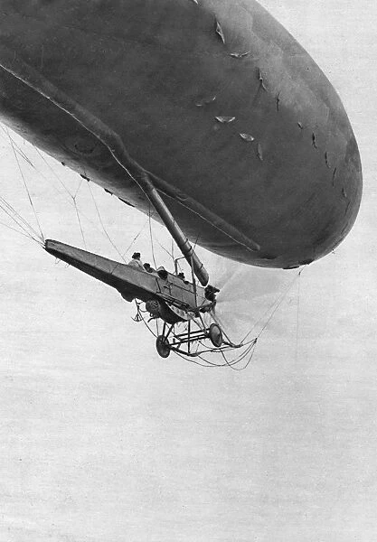 French Naval air scouts in an airship on a mission to find enemy submarines during World War I. Photograph, 1917