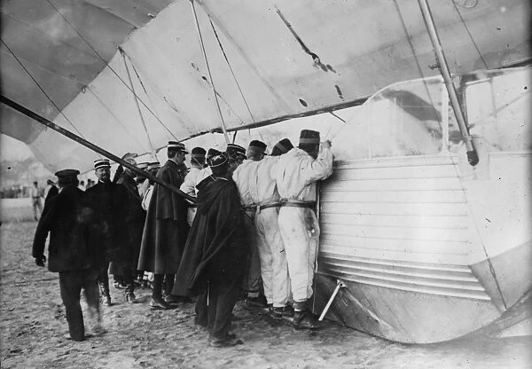French soldiers examining a Zeppelin dirigible, which landed at Luneville, France, in 1913, during World War I