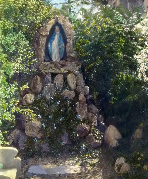 GARDEN SHRINE, 1915. A Marian shrine in a garden