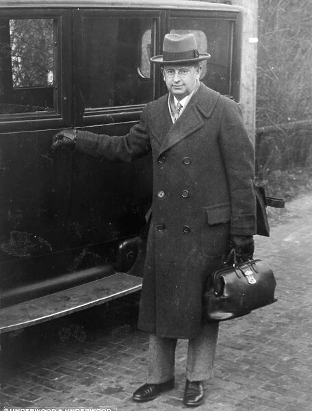 GEORGE C. CALVER, 1928. Congressional physician George C. Calver carrying his medical bag