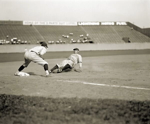 GEORGE H. RUTH (1895-1945). Known as Babe Ruth. American baseball player for the New York Yankees. Ruth safely sliding into third base during a game against the Washington Senators, 1925. The Senators third baseman is Ossie Bluege