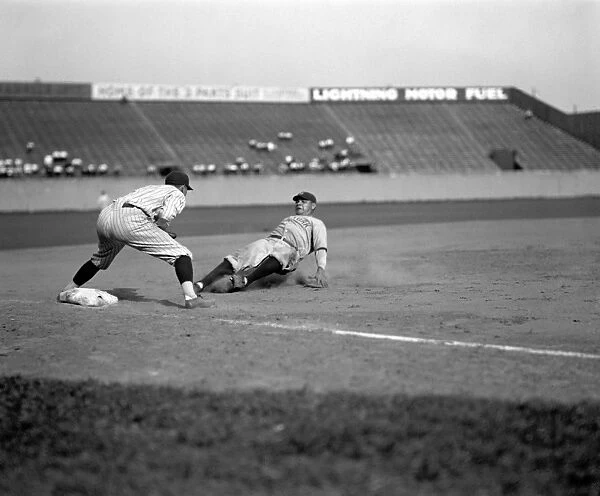 GEORGE H. RUTH (1895-1945). Known as Babe Ruth. American baseball player for the New York Yankees. Ruth safely sliding into third base during a game against the Washington Senators, 1925. The Senators third baseman is Ossie Bluege