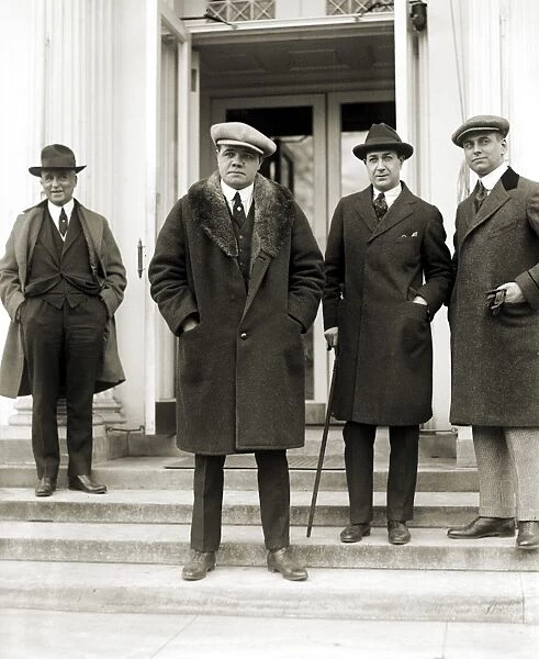 GEORGE H. RUTH (1895-1948). Known as Babe Ruth. American professional baseball player. Ruth (center) photographed outside the White House in Washington, D. C. 1921