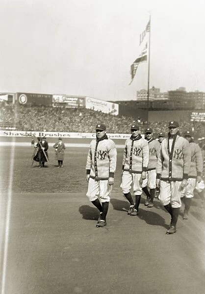 GEORGE H. RUTH (1895-1948). Known as Babe Ruth. American professional baseball player. Leading the group of New York Yankees during a ceremony for the opening of Yankee Stadium, 1923