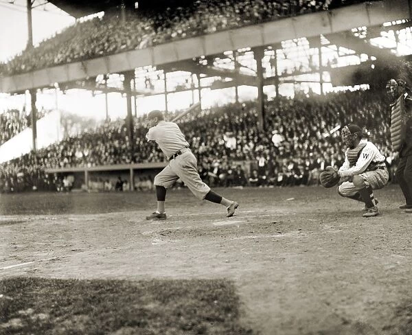GEORGE H. RUTH (1895-1948). Known as Babe Ruth. Ruth swinging at a pitch during a game against the Washington Senators, c1921