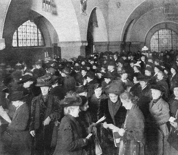 GERMAN WAR BONDS, 1915. German civilians purchasing war bonds at the municipal
