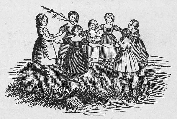GIRLS PLAYING, 1844. Girls at play, with their hands joined together in a circle. Wood engraving, American, 1844