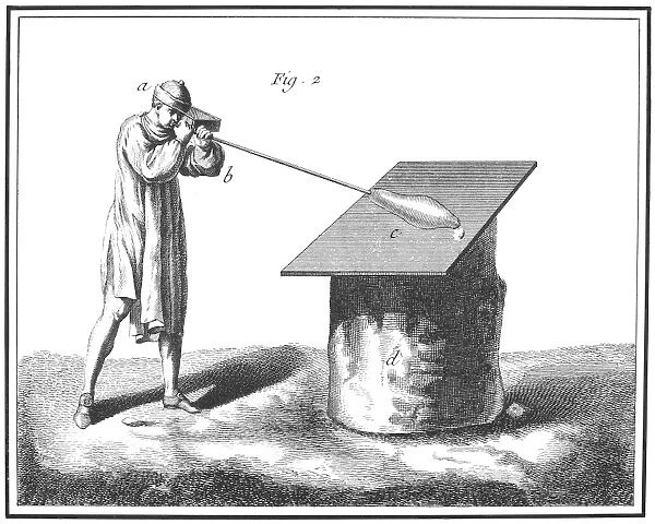 GLASSBLOWING, 18th CENTURY. The glassmaker begins to blow the glass after the second heat. Copper engraving, French, 18th century