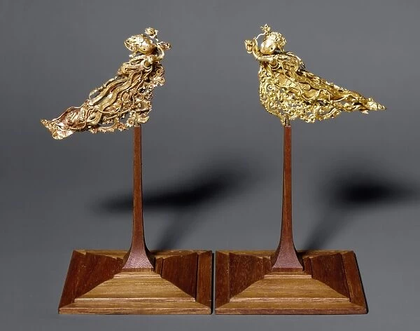 Gold headdress ornaments in the form of a pair of apsarases (angels of Buddhist mythology). T ang Dynasty, 618-907 A. D