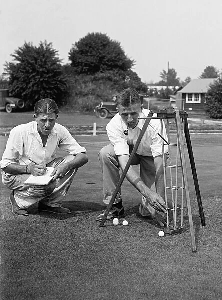 GOLF COURSE, 1929. Men conducting an experiment on the green at a golf course. Photograph