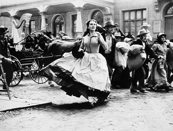GONE WITH THE WIND, 1939. Vivien Leigh, as Scarlett O Hara, running through the streets of Atlanta
