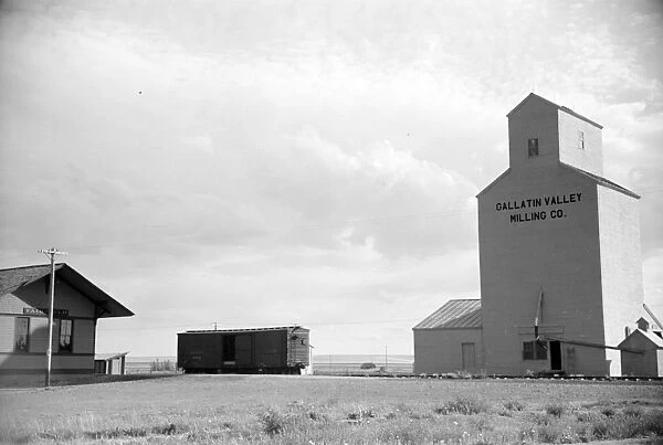 GRAIN ELEVATOR, 1939. A grain elevator at a railroad station in Fairfield, Montana