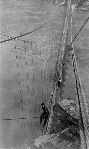 GRAND CANYON: BRIDGE, 1928. Rigger working on the Kaibab Trail Suspension Bridge
